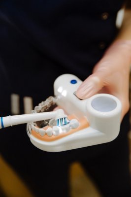 Electric toothbrush head being used